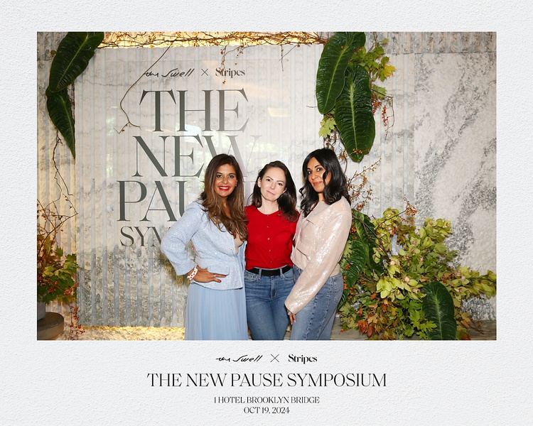 Three women at The New Pause Symposium backdrop